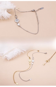 Close-up of sparkling round rhinestone bracelet detail with K14 metal tag and extender chain