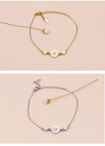 Detailed close-up of gold and silver rhinestone bracelets with Roman numeral charms