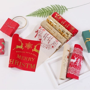 Christmas table runner with gold reindeer and snowflake prints on faux linen fabric