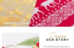 Detail of Christmas table runner featuring golden reindeer and snowflake prints on linen