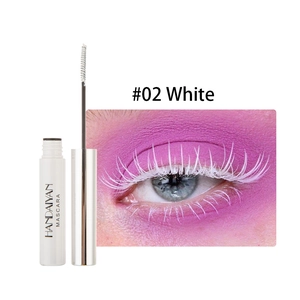 Close-up of white mascara effect on eyelashes with pink eyeshadow and product wand