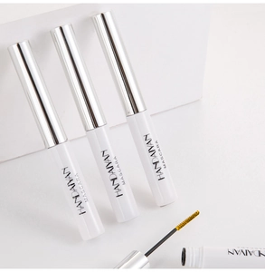 Detail showing the golden mascara brush and elegant white tubes of waterproof mascara