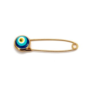 Macro shot of a golden safety pin brooch featuring a colorful round evil eye bead detail
