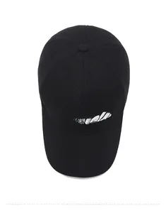 Top view of a black wool baseball cap featuring white Guanlala script embroidery detailing