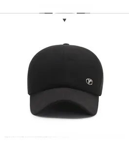 Detailed front view of black winter baseball cap with silver metal logo for elderly men