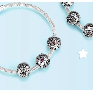 Macro shot of S925 sterling silver birthstone charms with month engravings and gems