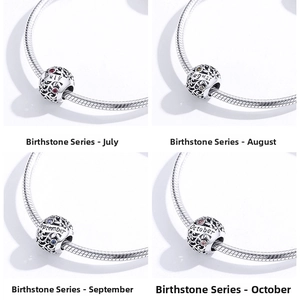 Detail of S925 sterling silver birthstone charms for July to October on a snake chain