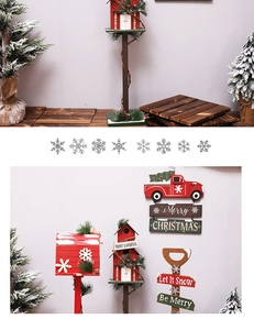 Close-up of wooden Christmas mailbox and vintage truck sign with pine needle accents