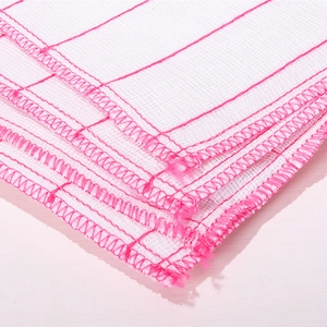 Absorbent white cotton gauze dishcloth with pink stitched edges for kitchen cleaning