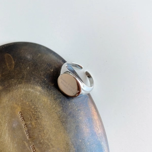 Macro shot of 925 sterling silver ring with Some kind of Wonderful engraving