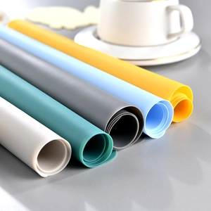 Rollable silicone placemats in multiple Morandi colors on a dining table setup