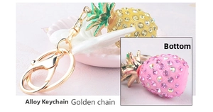 Detailed macro view of crystal rhinestones on a pineapple-shaped golden keychain charm