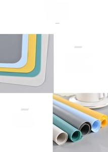 Detail of colorful silicone placemats showing soft flexibility and easy roll-up storage