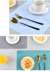Close-up of minimalist Morandi silicone placemats with elegant stainless steel cutlery