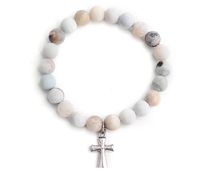 Detail of 8mm natural stone beaded bracelet featuring a silver metal cross pendant