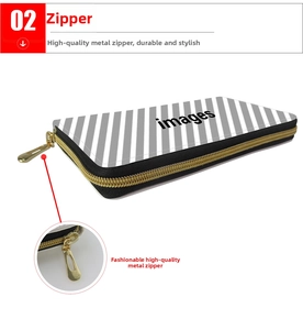 Detail showing premium golden metal zipper on grey striped long wallet with smooth puller