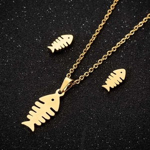 Golden fishbone jewelry set featuring a minimalist necklace and stud earrings in stainless steel