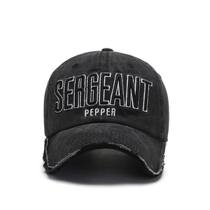 Washed black denim baseball cap with white Sergeant Pepper embroidery and distressed brim