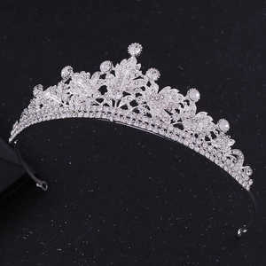 Elegant silver leaf bridal crown with sparkling white rhinestones on a dark background