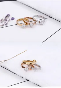 Set van drie titanium stalen ringen in goud, roségoud en zilver met ronde kristallen