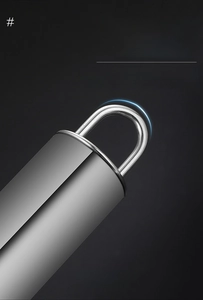Macro shot of stainless steel whisk handle with a curved hanging hook for kitchen storage