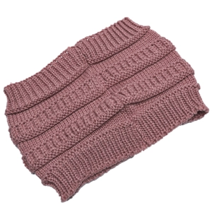 Close-up of chunky ribbed knit texture on a wide dusty pink winter headband for women