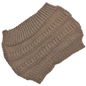 Detailed close-up of brown knitted texture on winter headband and ponytail beanie hat