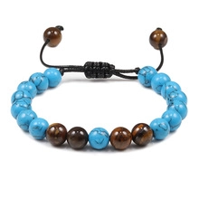 Detail of adjustable braided bracelet with blue turquoise and brown tiger eye beads