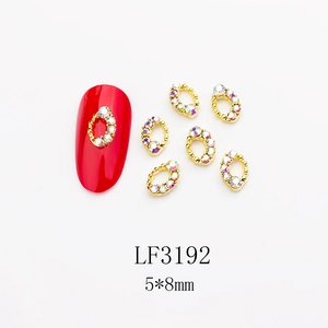 Golden nail art charms with rainbow rhinestones on red nail model, LF3192 5x8mm