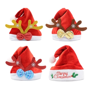 Assorted red velvet Christmas hats with embroidered reindeer antlers and bowknot designs