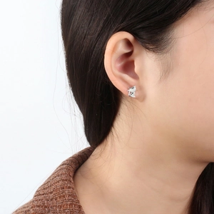 Close-up of S925 sterling silver kitten stud earrings with sparkling zircon on ear
