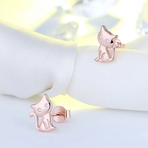 Macro detail of rose gold S925 sterling silver cat earrings with sparkling zircon stones