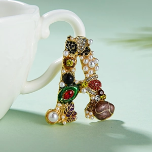 Vintage gold letter A brooch with pearls, colorful crystals and enamel flower detail