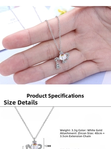 Detailed view of teapot-shaped crystal pendant with dimensions and 3.3g weight data
