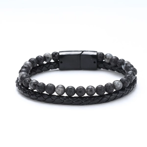 Detail of multi-layer leather bracelet featuring tiger eye beads and black magnetic clasp