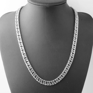 Close-up of a silver Cuban link chain necklace displayed on a black neck mannequin bust