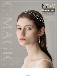 Detailed view of elegant bridal hair chain and matching pearl earrings on a model