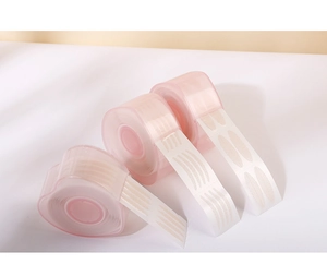 Three rolls of mesh eyelid tapes in olive, crescent, and slim shapes on white background