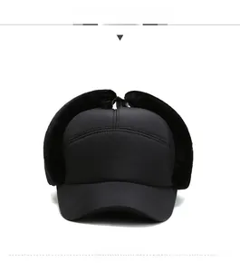 Front view detail of a black winter windproof baseball hat with warm faux fur ear flaps