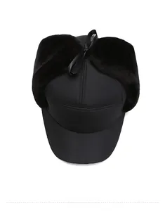 Top down view of black winter aviator hat with thick faux fur lining and windproof fabric