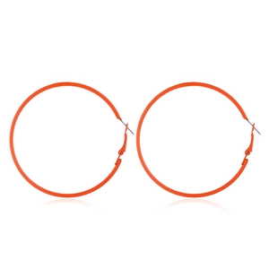 Neon orange hoop earrings in classic 80s retro style with polished finish on white backdrop