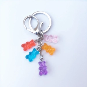 Macro view of colorful gummy bear pendants on metal keyrings with lobster clasps