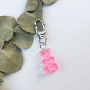 Detailed view of a pink translucent gummy bear keychain with silver metal lobster clasp