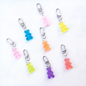 Colorful resin bear keychains in multiple vibrant candy colors with metal lobster clasps