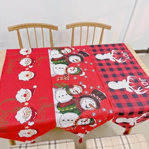 Detailed view of Christmas table runners with Santa, Snowman and Reindeer patterns