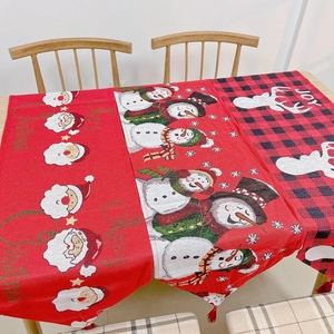 Detailed view of Christmas table runners with Santa, Snowman and Reindeer patterns