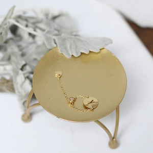 Detail of 14K gold-plated titanium chain ring with K letter and heart charms