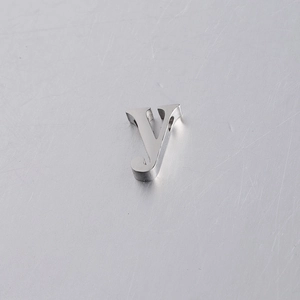 Detailed macro view of a 10mm mirror-polished stainless steel letter Y alphabet bead