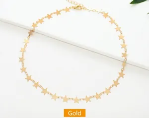 Detailed close-up of golden necklace with star sequins and adjustable lobster clasp