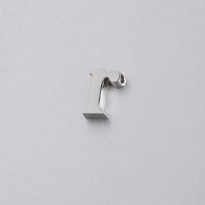 Close-up of polished silver stainless steel 10mm letter r bead for jewelry making